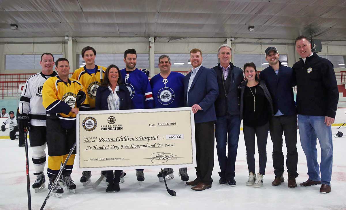 Team Wealth GPT captain Jay Corrigan (second from left) with draft pick Ray Bourque (second from right) and NHL Pro-Am founder Mike Griffin (at right)